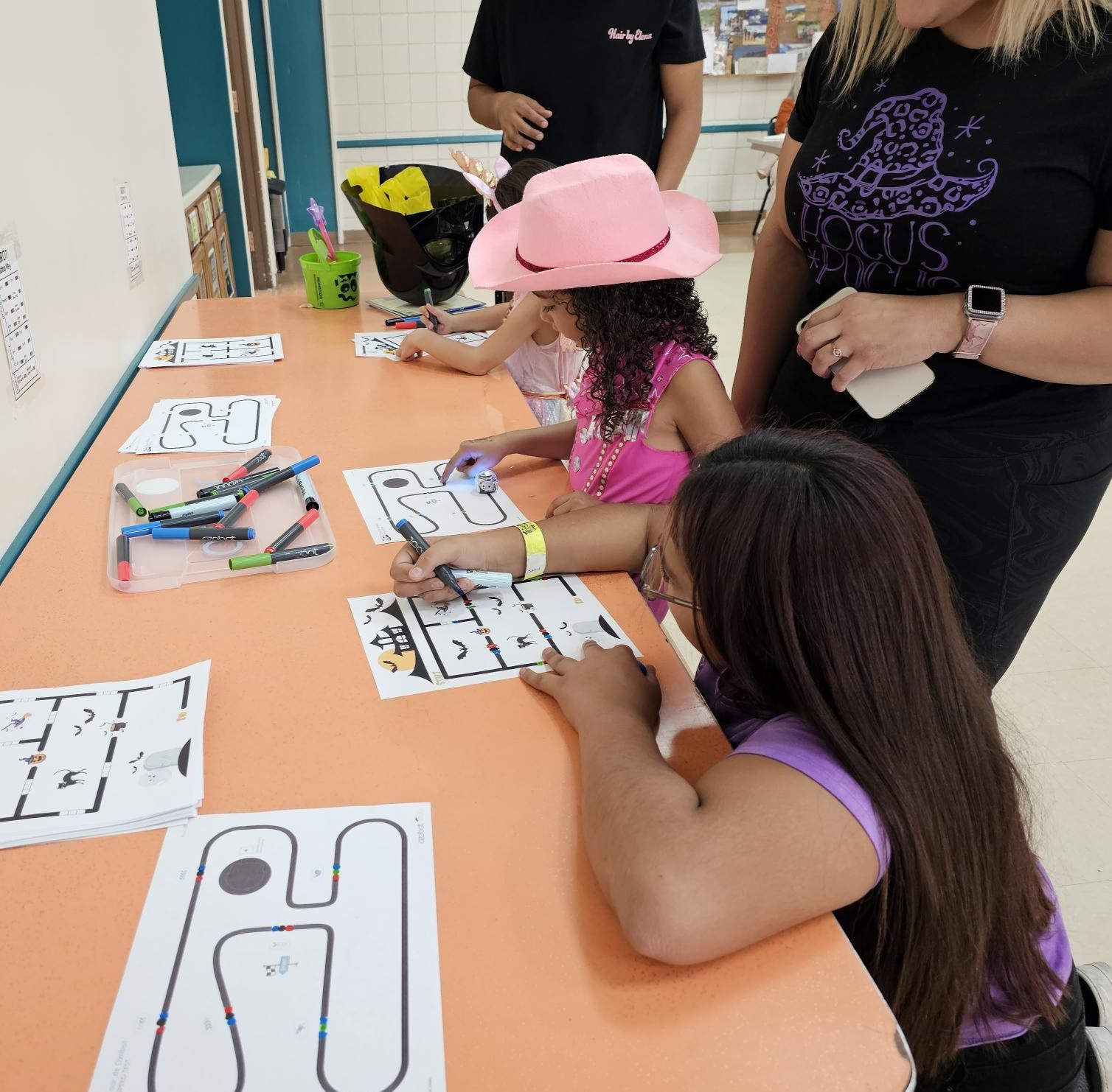 Children working with Ozobots